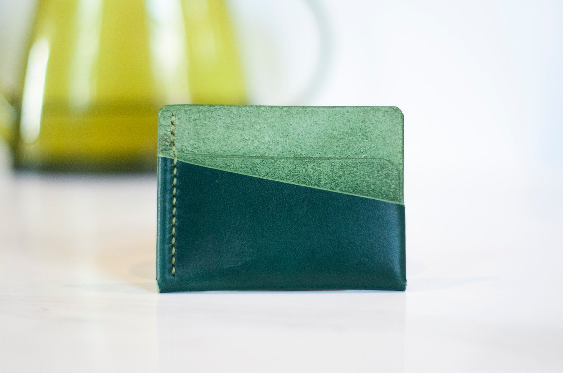 Green leather handmade wallet used as a front pocket wallet